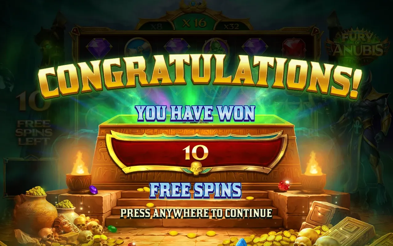 Congratulations screen shows 10 Free Spins won on a golden chest atop stone steps with torches.